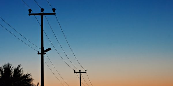 Electric power lines against a dawn sky