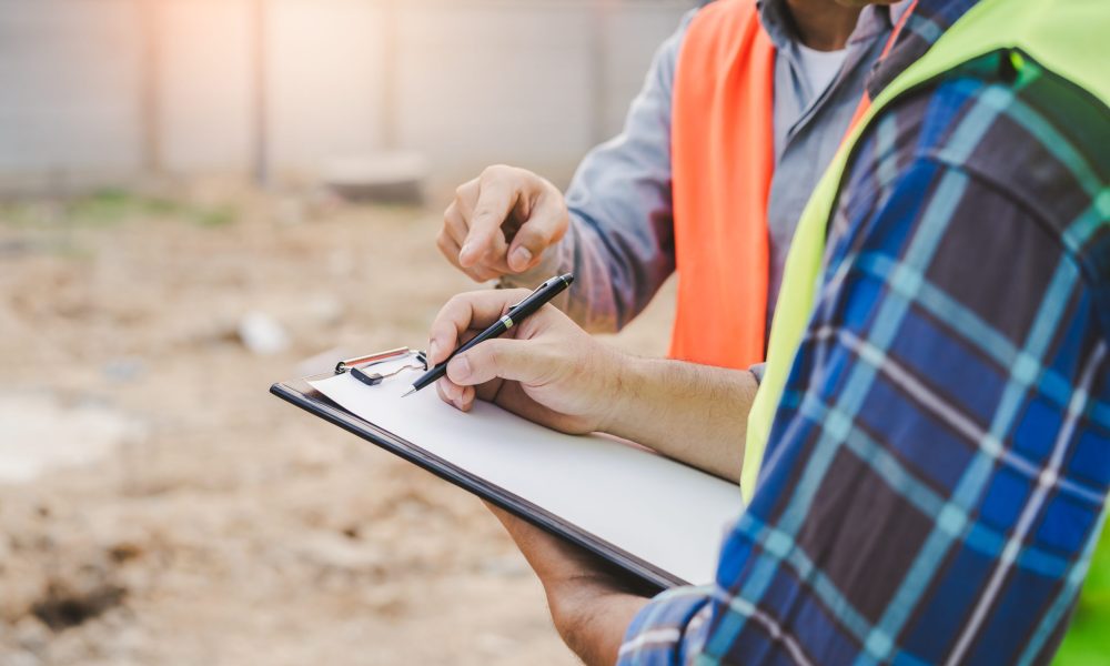 contractor and foreman looking at blueprint